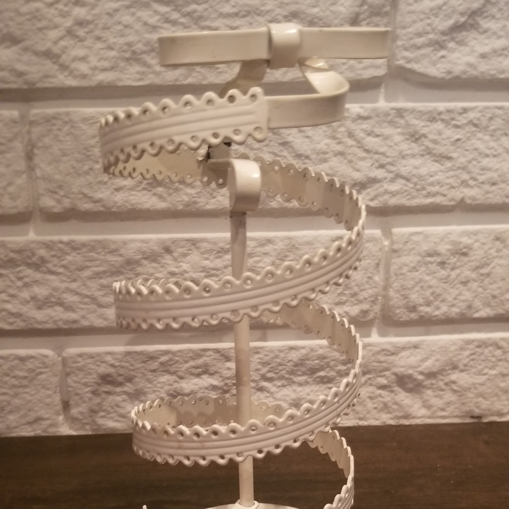 White spinning jewelry stand